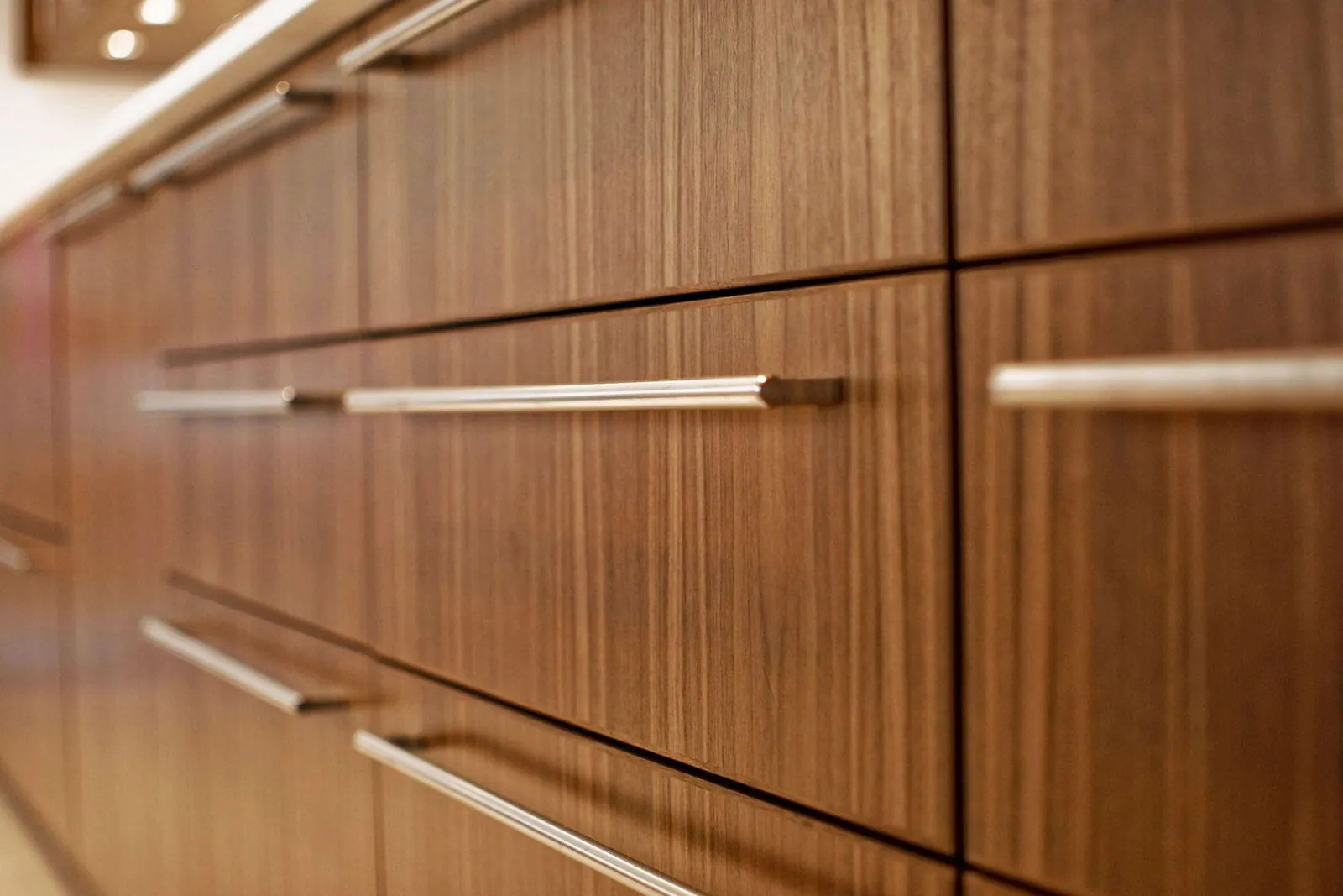 Green and wood-toned multiwood kitchen cabinetry